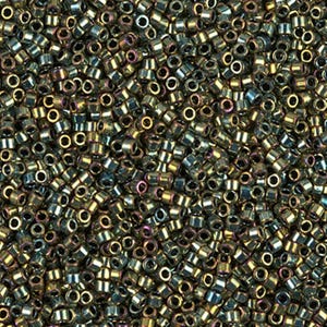 May include: A close-up image of a large quantity of small, round, metallic beads. The beads are a mix of gold and green with a iridescent finish.