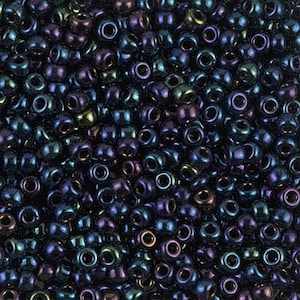 May include: A large quantity of dark blue iridescent seed beads. The beads have a metallic sheen and are perfect for jewelry making.