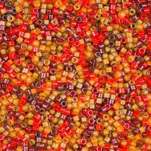 May include: A close-up view of a pile of small, cylindrical beads in shades of red, orange, and yellow. The beads are densely packed together, creating a textured surface. These beads are suitable for jewelry making and craft projects.