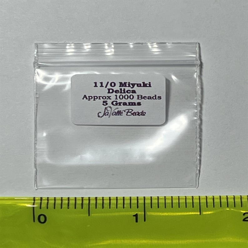 May include: A small clear plastic bag containing 11/0 Miyuki Delica beads. The bag has a white label with the text "11/0 Miyuki Delica Approx 1000 Beads 5 Grams Ja-alt&eacute; Beads".