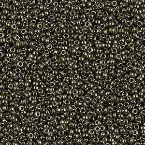 May include: A close-up view of a large quantity of small, round, metallic beads. The beads are a dark, metallic green color with a slight sheen.