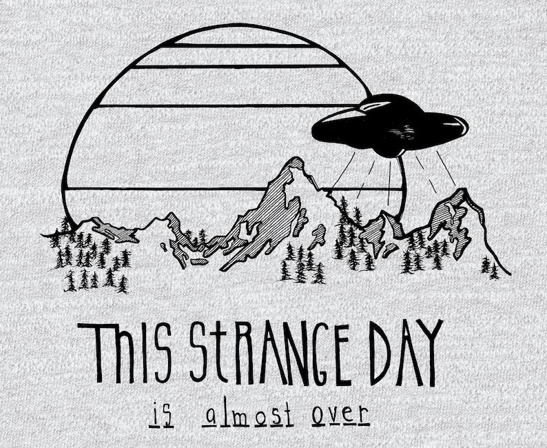 May include: Black and white illustration of a UFO hovering over a mountain range with a retro sunset behind it. The text "This strange day is almost over" is below the image.