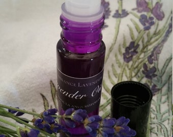 Lavender Essential Oil with a purple roller ball applicator