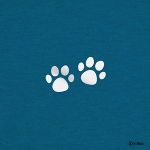 May include: Two white paw prints on a teal blue background.