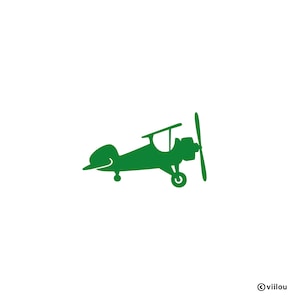 May include: A green silhouette of a vintage aeroplane with a propeller. The aeroplane is facing right and has a single wing on each side.