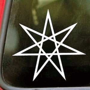 May include: White vinyl sticker of an eight-pointed star with an intricate design. The star is outlined in a thick white line and has a smaller star inside.