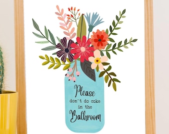 May include: A framed print with a floral design. The flowers are in a blue mason jar with the text "Please don't do coke in the Bathroom".