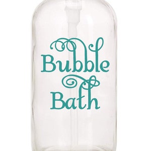 May include: Clear glass bottle with a stainless steel pump dispenser. The bottle has a teal green vinyl decal that says "Bubble Bath" with decorative swirls.