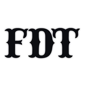 May include: Black stylized letters FDT on a white background. The letters have a decorative, vintage-inspired design with curved serifs and a bold, solid appearance. The image is simple and graphic.