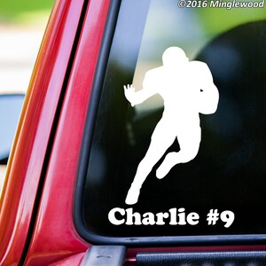 May include: White silhouette of a football player running with the ball. The player's name "Charlie #9" is printed below the silhouette.
