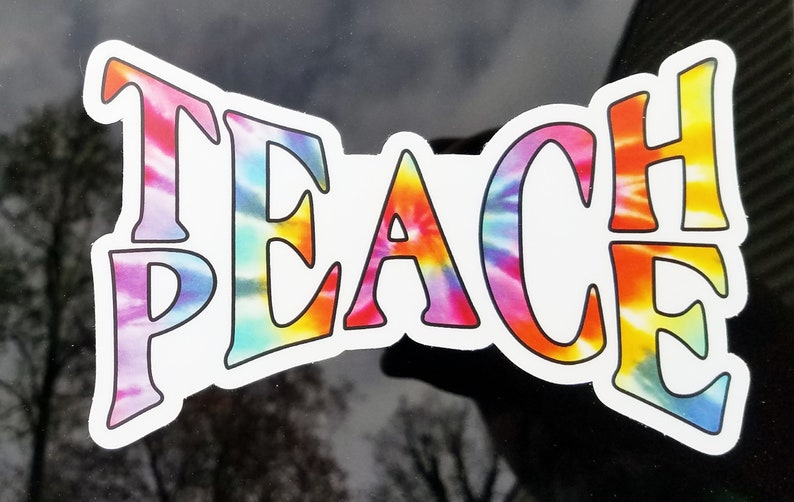 A window featuring the 'Teach Peace sticker', showing how it transforms any glass surface into a statement of advocacy.