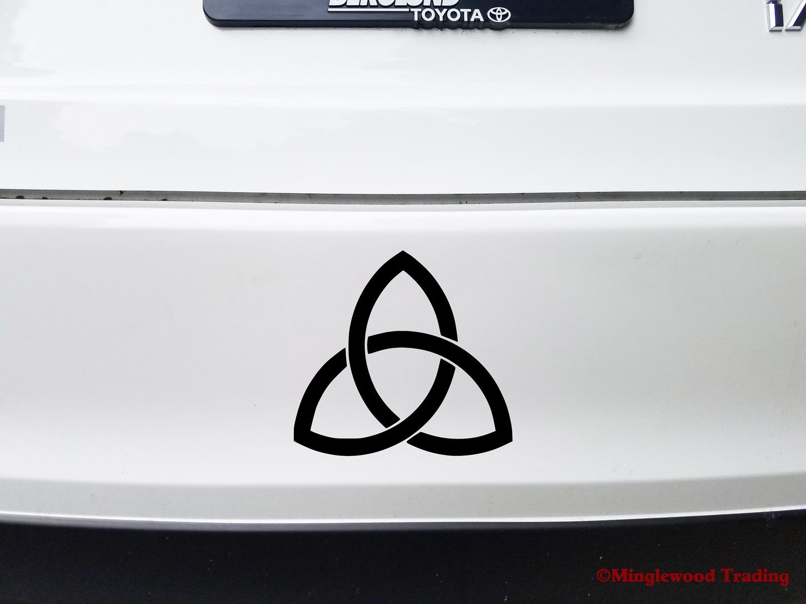 Trinity knot triquetra with sun and moons Sticker by ChristineKrahl