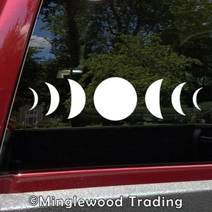May include: A white vinyl sticker with a moon phase design. The sticker shows the moon in different phases, from a crescent to a full moon.