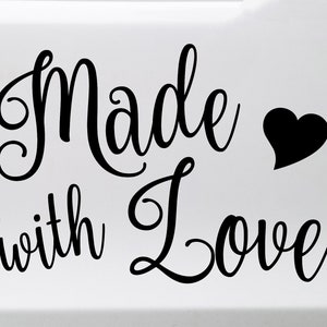 May include: Black and white cursive text that reads "Made with Love" with a black heart symbol.