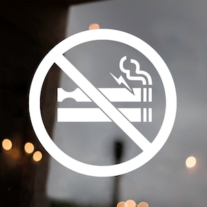 May include: A white no smoking sign with a red circle and a diagonal line through a cigarette with smoke coming from it.