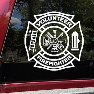 May include: White vinyl decal of a firefighter's emblem with the words "Volunteer Firefighter" in a circle.
