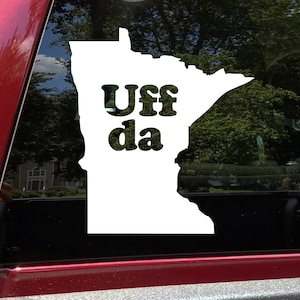 May include: White vinyl sticker of the state of Minnesota with the text "Uff da" in a retro font.