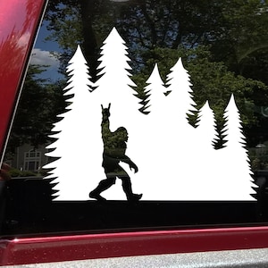 Bigfoot Sign of the Horns in Tree Line Vinyl Decal V3 | Metal Music Sasquatch Pine Trees | Die Cut Sticker