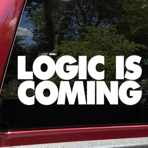 May include: White vinyl sticker with the text "LOGIC IS COMING" on a black background. The sticker is applied to the back window of a red car.