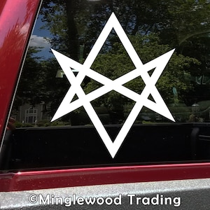 May include: White vinyl sticker of a six-pointed star with an overlapping design. The star is on a black background.