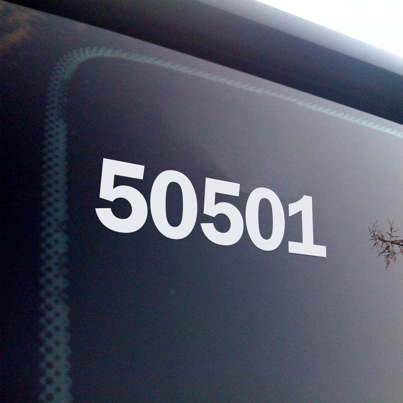 May include: White numbers "50501" are displayed prominently on a dark surface, possibly a window or screen. The numbers are large and easy to read, with a clean, modern font. The background is a gradient of dark colors.