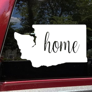 May include: White vinyl decal of the state of Washington with the word "home" in a cursive font.