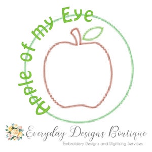 Op de afbeelding: Groen borduurontwerp van een appel met de tekst "Apple of my Eye" eromheen. Het ontwerp is voor borduur- en digitaliseringsservices.