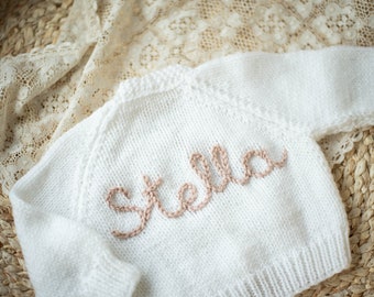 White Personalised baby cardigan with dusky pink letters