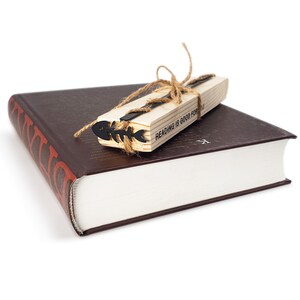 Unique Fishbone bookmark on the wooden packaging block - Coolbookmark.
