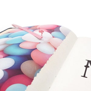 Pink metal bookmark Flamingo. A long, flat metal stick stays between the pages of the book - Cool Bookmarks
