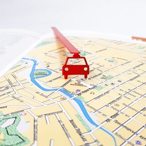 May include: A red car marker on a map with the text "вул. Богдана Хмельницького" and "вул. Карла Маркса".