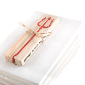 May include: A wooden bookmark with a red metal trident and the text "Reading is good for you".
