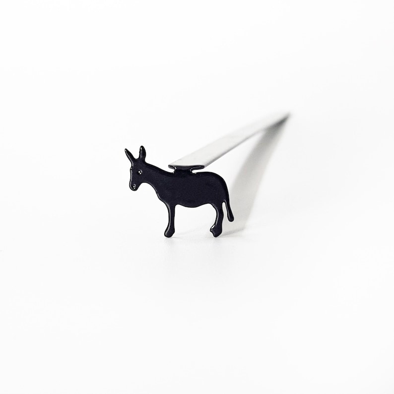 Black metal donkey bookmark close-up product detail shot with shadow