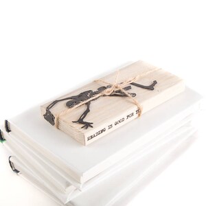 Metal Bookmark Happy Reading Skeleton by Coolbookmark on Etsy. Perfect gift for horror book lovers with a sense of humour. Great Skeleton party favor. Unique Eco friendly gift packaging ready to give.