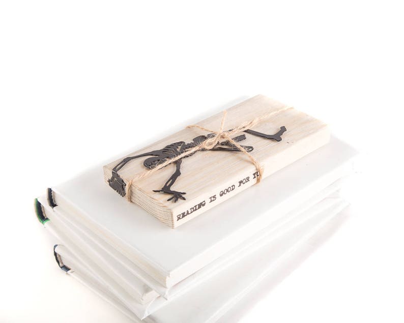 Metal Bookmark Happy Reading Skeleton by Coolbookmark on Etsy. Perfect gift for horror book lovers with a sense of humour. Great Skeleton party favor. Unique Eco friendly gift packaging ready to give.