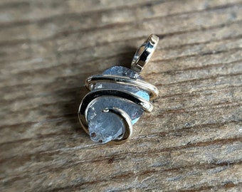 Faceted diamond in 14k gold pendant