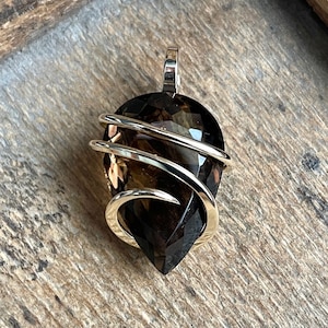 Faceted smoky quartz in 14k gold pendant