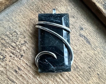 Faceted rutilated quartz in sterling silver pendant