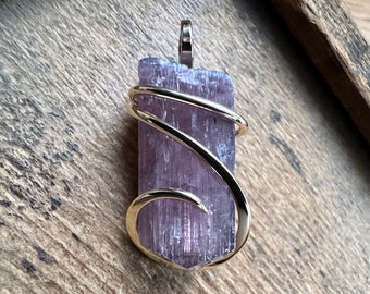 Purple tourmaline crystal in 14k gold pendant