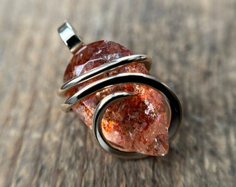 Faceted rainbow sunstone in 14k gold pendant