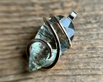 Faceted epidote in quartz in 14k gold pendant