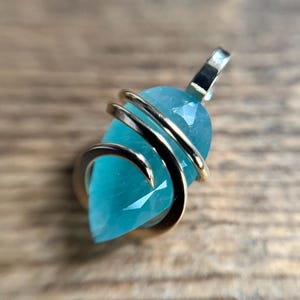 Faceted grandidierite in 14k gold pendant