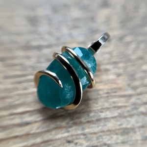 Faceted grandidierite in 14k gold pendant