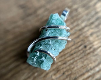 Emerald in forged sterling silver pendant