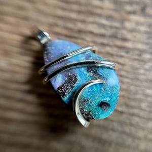 Boulder opal in 14k gold pendant