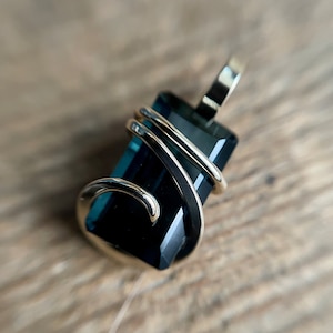 Faceted blue tourmaline in 14k gold pendant