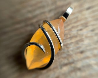 Faceted Mexican fire opal in 14k gold pendant