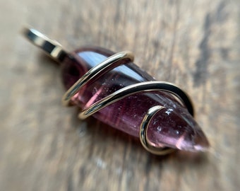 Purple tourmaline in 14k gold pendant