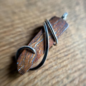 Boulder opal in forged sterling silver pendant