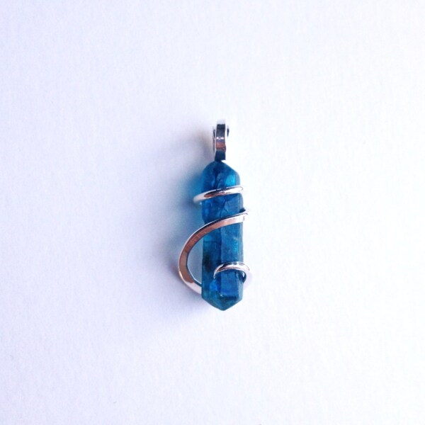 Apatite crystal tension set in hand forged polished sterling silver pendant